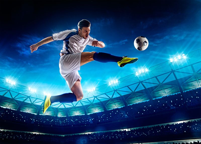 Football Player scoring goal in last minute