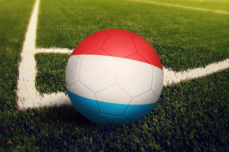 Luxembourg flag over football