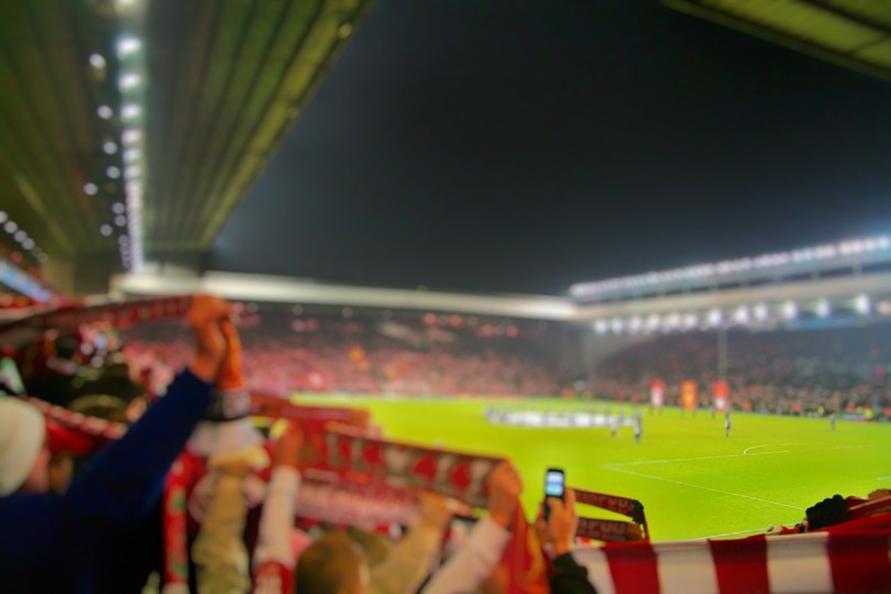 Blurred Fans at Anfield Celebrating in Evening Game