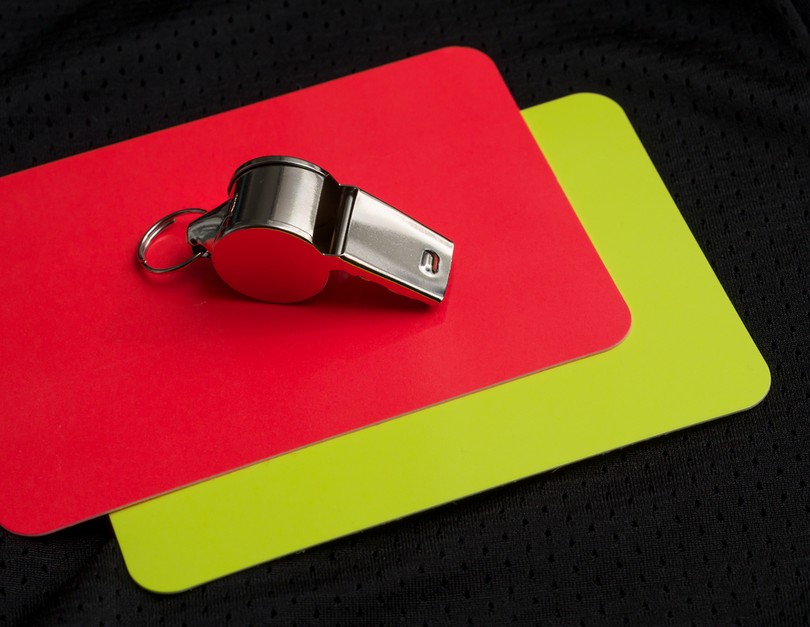Football Red and Yellow Cards Close Up with Whistle