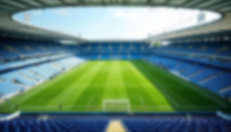 Blurred Blue Football Stadium Interior
